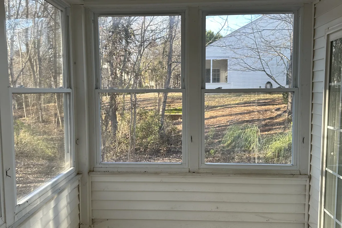 Pre-project porch view for vinyl enclosure deck in Elrose, Mecklenburg County NC