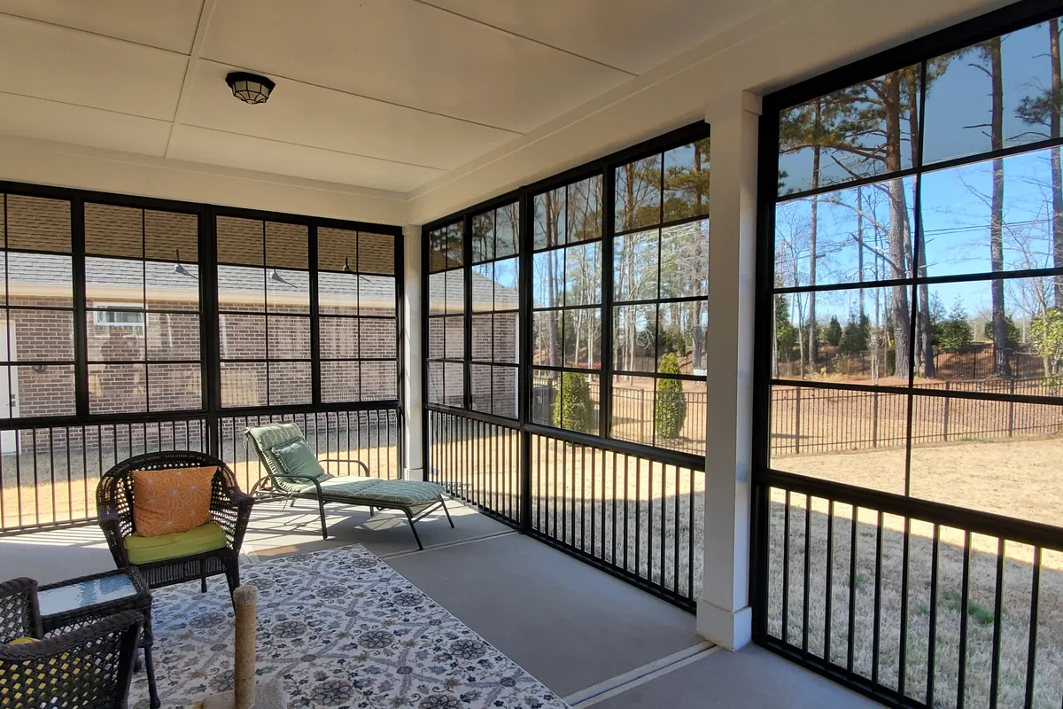 Finished seasonal porch enclosure detail vinyl film Mecklenburg County sunroom contractor