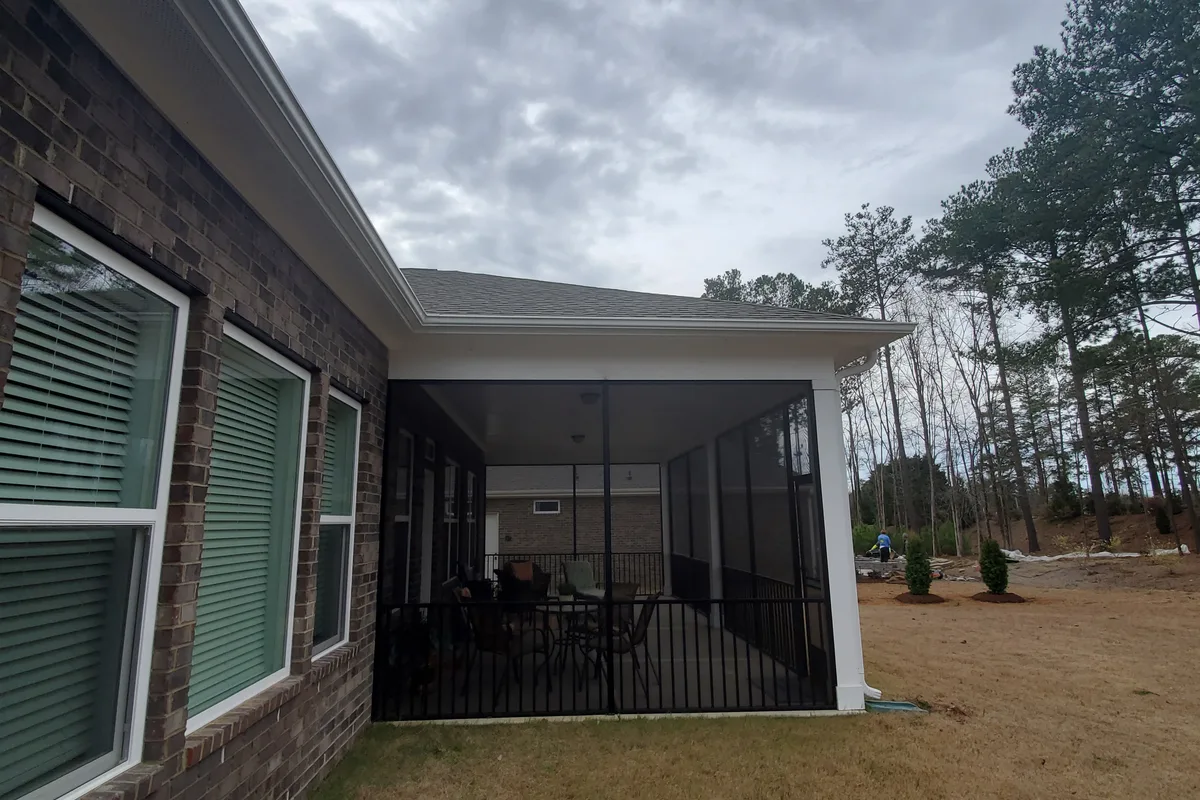 Existing open porch structure before vinyl film enclosure installation Matthews NC