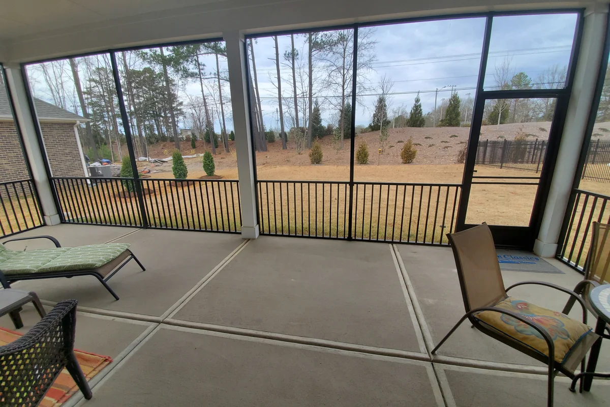 Completed 3-season vinyl film porch enclosure exterior at Livery Stable, Matthews NC