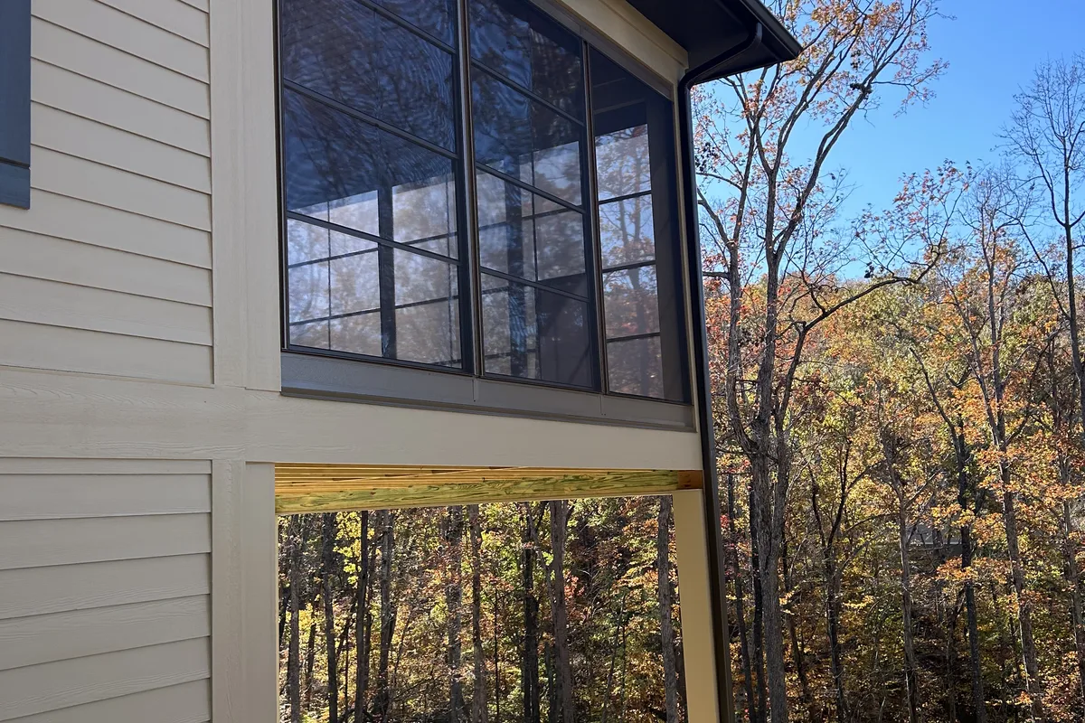 Porch enclosure vinyl film installation close-up Six Mile Pickens County