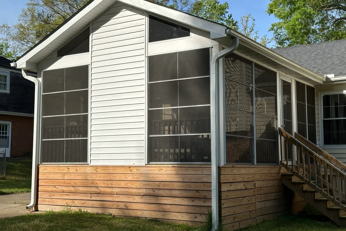Vinyl film enclosure installation detail showing completed sunroom in Charlotte