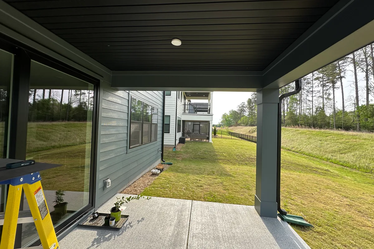 Before photo of porch ready for 3-season vinyl film enclosure Tega Cay
