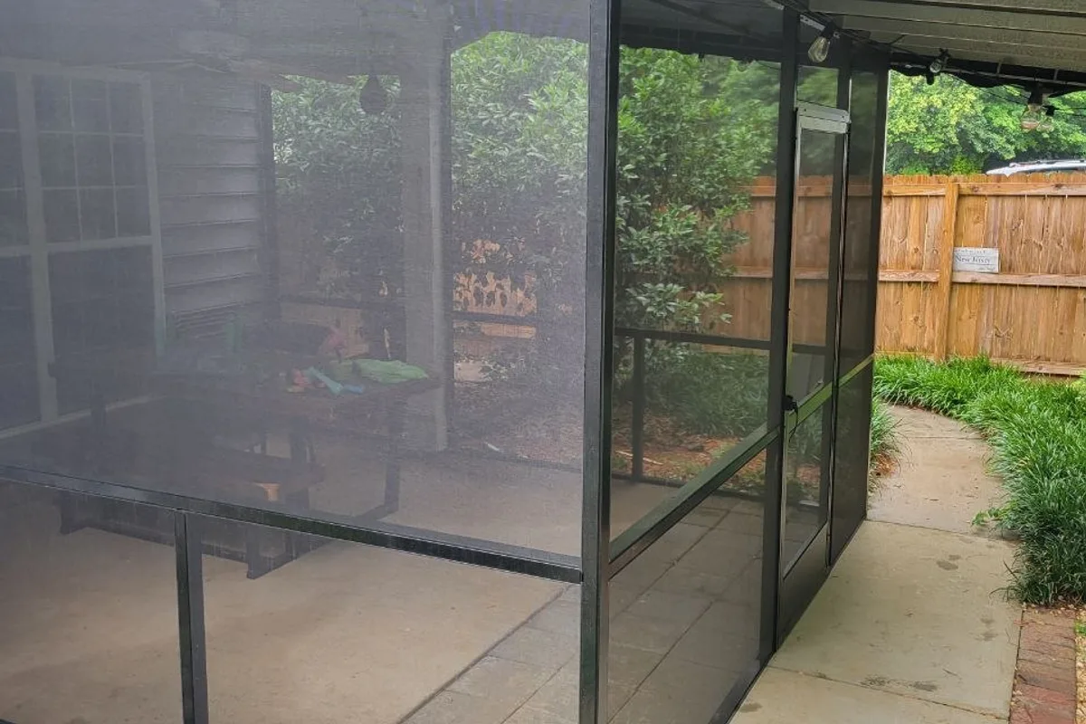 Screen room installation detail showing finished porch screening in Mecklenburg County NC
